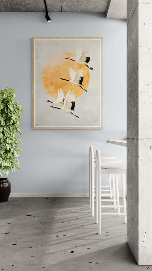 Cranes Wall Art Print featuring minimalist cranes flying against an orange circle, ideal for modern decor.